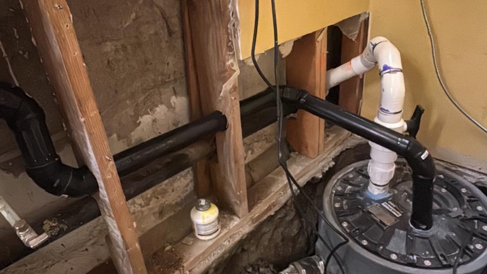 New residential drain and vent piping installed inside an open wall